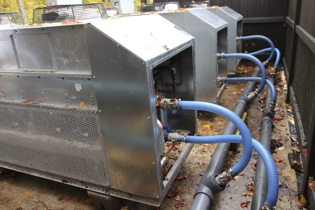 Refrigeration piping connection work during ice rink installation