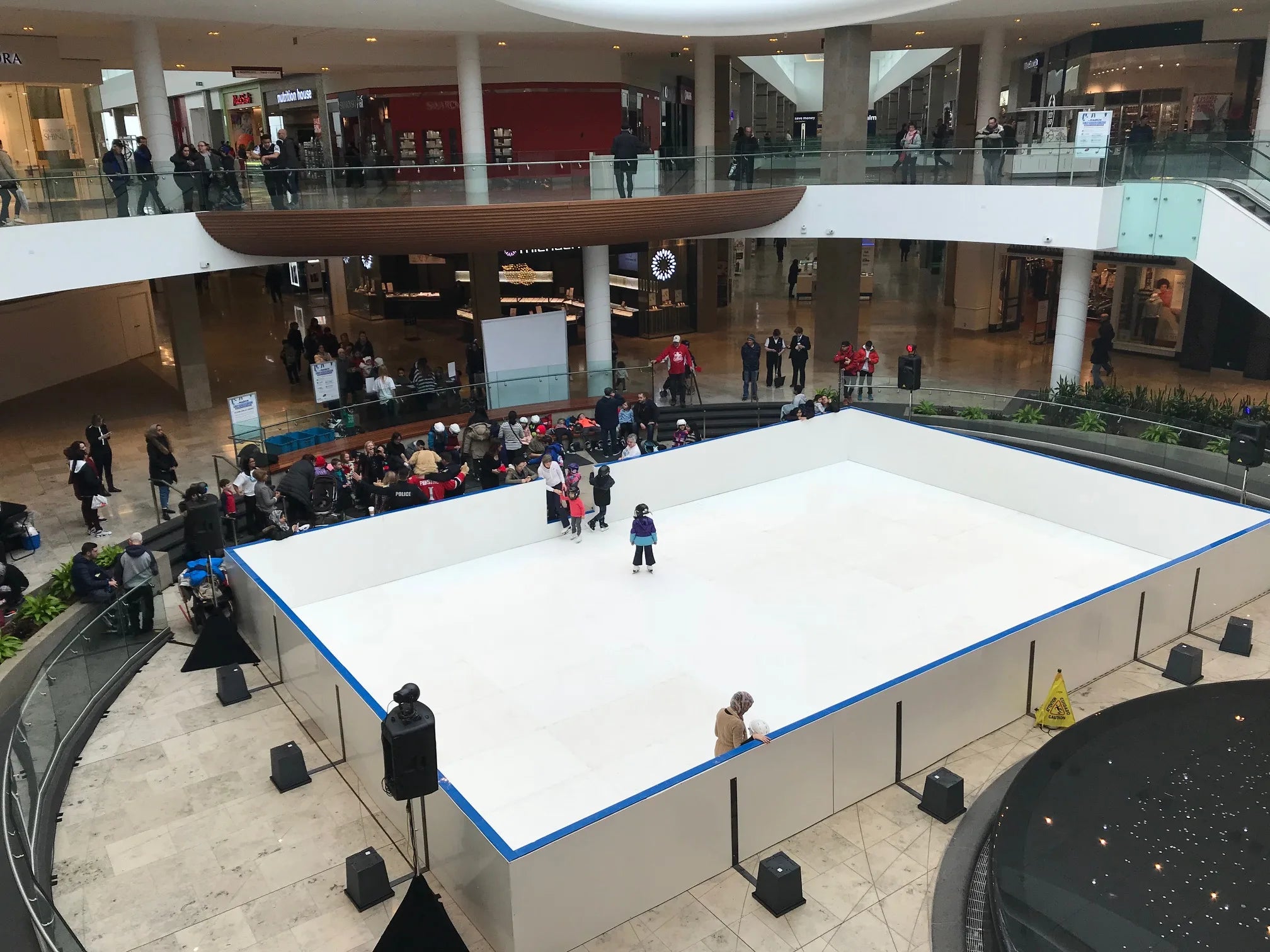 Finished indoor refrigerated ice rink with full boards and dasher system